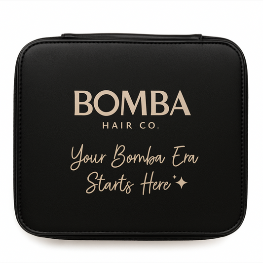 Black pouch with 'Bomba Hair Co.' branding and text on a black background